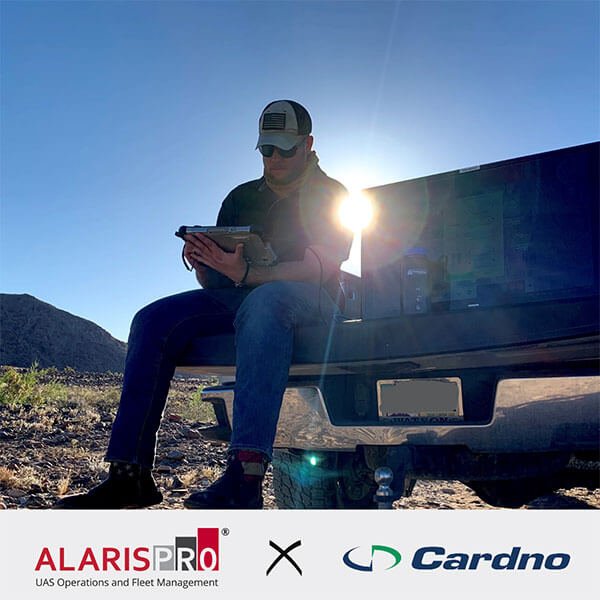 Cardno - using tablet on truck bed